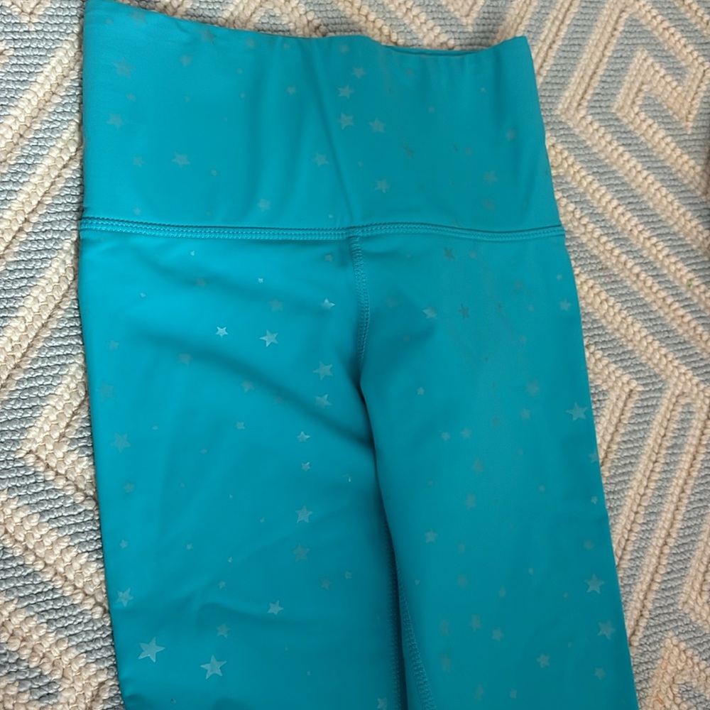 Terez leggings in turquoise with star design.  Xxs.  Never worn.